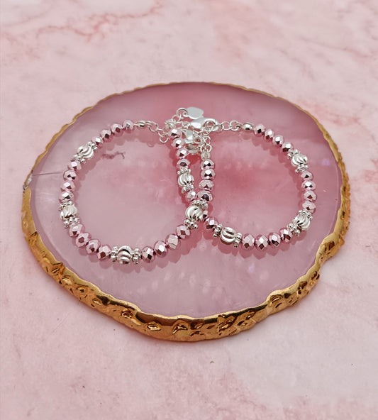 A Pair of Baby Bracelets in Metallic Pink and Silver Beads