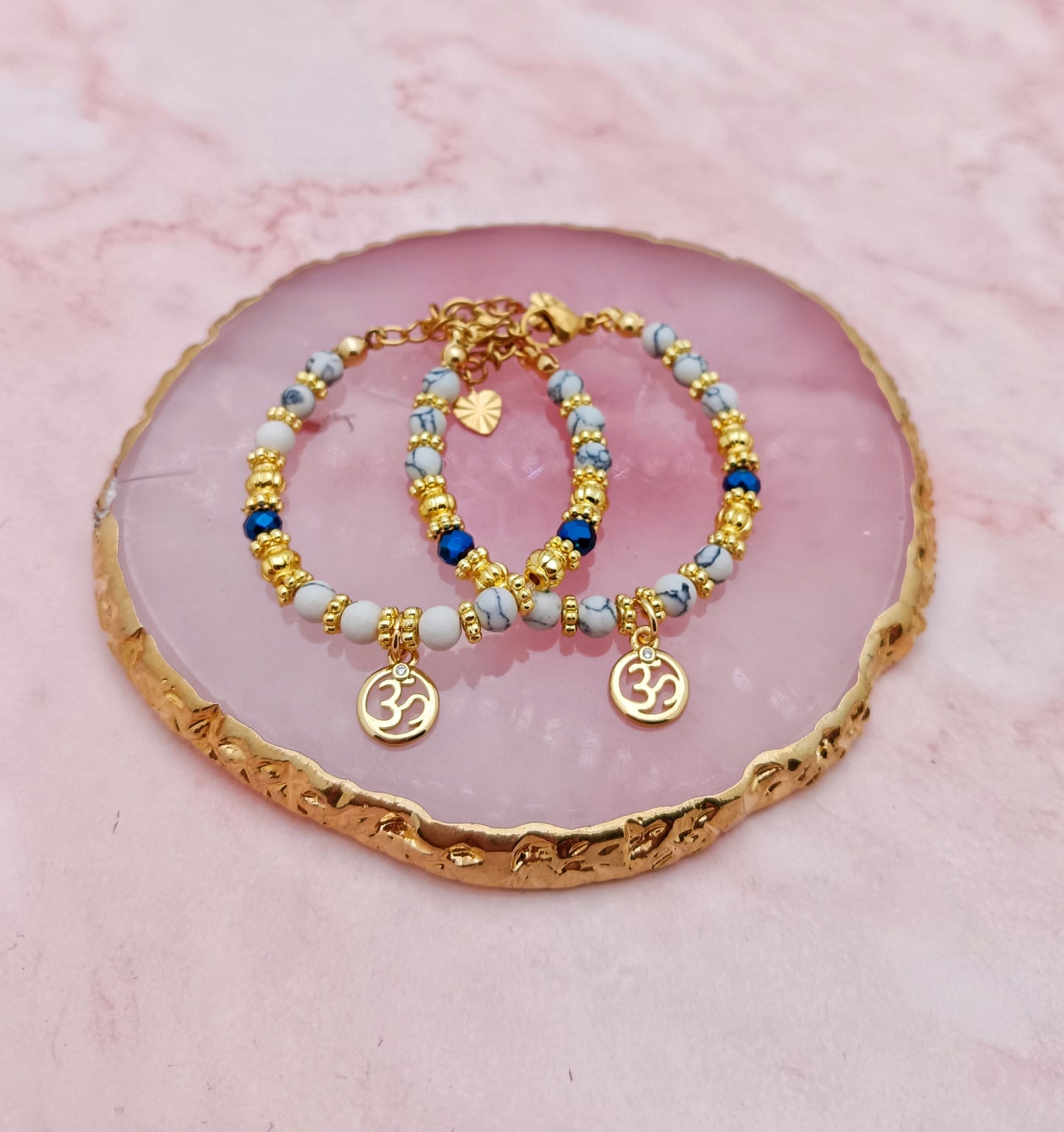 A Pair of Baby Bracelets with Hindi Aum Charms